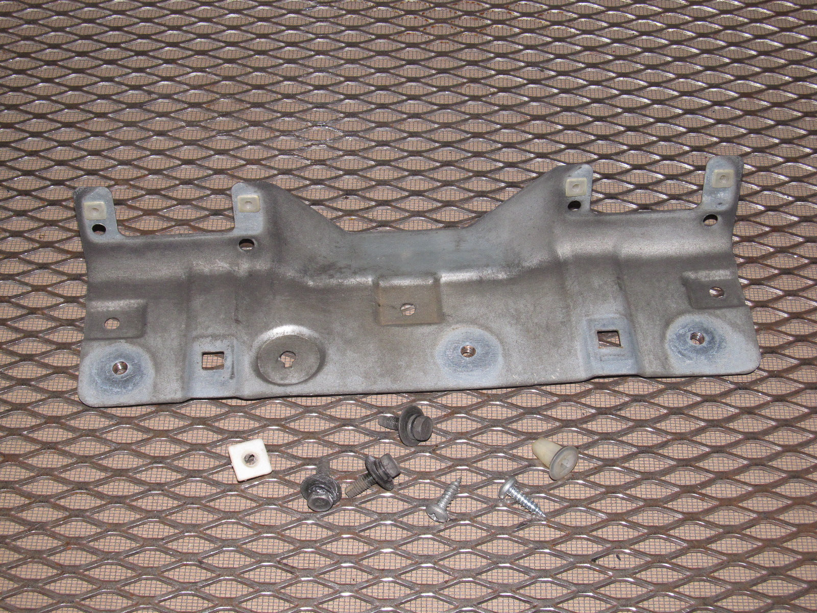 97 98 99 Mitsubishi Eclipse OEM Convertible Rear Bumper License Plate Mounting Bracket