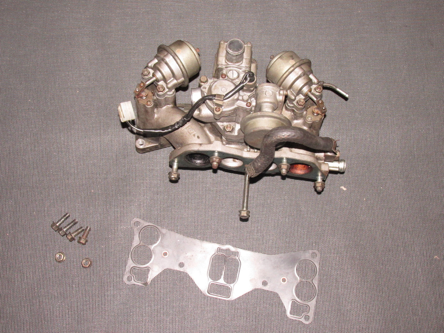 84 85 Mazda RX7 OEM 13B Lower Intake Manifold Assembly